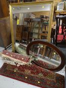 LARGE REPRODUCTION GILT FRAMED BEVELLED WALL MIRROR and another, and four sundry rugs