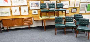 MID-CENTURY EXTENDING DINING TABLE, MATCHING CHAIRS & SIDEBOARD in teak-wood, the green leather