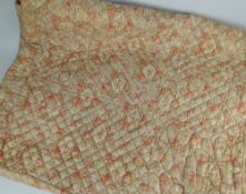 ANTIQUE BED QUILT with pink floral repeat design, 205 x 160cms