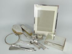 ASSORTED ENGLISH SILVER including rectangular easel-portrait frame 29.5 x 20.5cms, three-piece