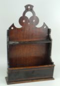 NINETEENTH CENTURY MIXED WOOD SPOON RACK with geometric open work frieze, 16cms high