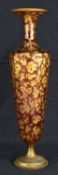 19TH CENTURY GILDED CRANBERRY GLASS TRUMPET VASE, possibly Bohemian, on a gilt metal decorated