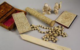 ANTIQUE LEATHER JEWELLERY BOX CONTAINING ASSORTED C19TH IVORY to include nice Chinese carved calling