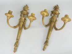PAIR OF FINE QUALITY ANTIQUE GILT METAL CANDLE SCONCES in the Classical-style with twin branches,