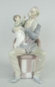 LLADRO PORCELAIN MODEL OF A MOUSTACHED GRANDFATHER & INFANT ON HIS LAP seated on a pink chair