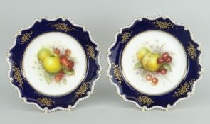 PAIR OF ROYAL WORCESTER PORCELAIN DISPLAY PLATES, the interiors painted with fruit by Richard