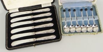 CASED SET OF SIX SILVER HANDLED BUTTER KNIVES and cased set of six coffee bean spoons