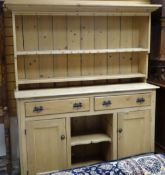 PINE DRESSER having two drawers, two cupboards, centre recess, 157cms wide
