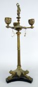 19TH CENTURY GILT METAL THREE BRANCH TABLE CANDELABRA in classical form with triform base, claw feet