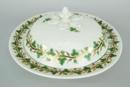 SWANSEA PORCELAIN MUFFIN DISH & COVER of circular form with acorn finial emerging from six leaves,
