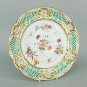 NANTGARW PORCELAIN PLATE having an oeil de perdrix border between gilded moulding of ribbons,