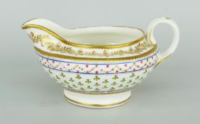 NANTGARW PORCELAIN CREAM JUG of squat form with loop handle decorated with gilding and various bands