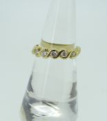 18CT YELLOW GOLD FIVE STONE DIAMOND WAVE DESIGN RING, 3.7 grams. Condition Report: Good overall