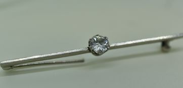 WHITE METAL SINGLE STONE DIAMOND BAR BROOCH the diamond measuring 0.5cts approximately in T. W. Long