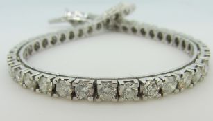 DIAMOND LINE BRACELET of forty-six round cut diamonds, approx 10-12cts total, set in 18ct white