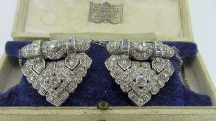 PAIR OF WHITE METAL ART DECO DIAMOND ENCRUSTED BROOCHES of bar and arrow head form with sterling