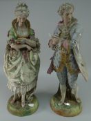 PAIR OF TALL BISQUE PORCELAIN FIGURES IN REGENCY COSTUME standing against tree stumps,