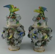 PAIR OF MEISSEN STYLE SCHNEEBALLEN COVERED VASES of urn form, the domed lids with surmounted