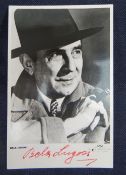 BELA LUGOSI (1882 - 1956) AUTOGRAPHED BLACK & WHITE PUBLICITY PHOTOGRAPH the actor with cigar, in