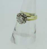18CT YELLOW GOLD DIAMOND FLOWER CLUSTER RING, the central stone (approximately 0.40ct), surrounded