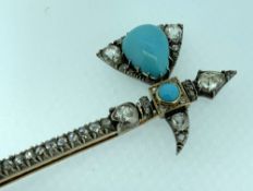 YELLOW & WHITE METAL DIAMOND AND TURQUOISE ENCRUSTED BAR BROOCH in the form of an antique axe in