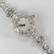 ROLEX LADIES DIAMOND ENCRUSTED PLATINUM SET WRISTWATCH of Art Deco design with 9ct white gold
