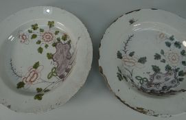 PAIR OF EIGHTEENTH CENTURY ENGLISH DELFT SHALLOW DISHES interiors naively decorated with