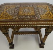 ISLAMIC INTARSIA TABLE of octagonal form, mother-of-pearl inlay and marquetry all round, the top