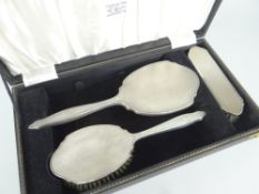 CASED THREE-PIECE SILVER DRESSING-TABLE SET mirror, two brushes, engine-turned, Birmingham 1959