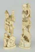 TWO MEIJI PERIOD JAPANESE IVORY OKIMONO being a musician standing on a grotesque mask with child,