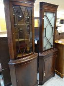 TWO REPRODUCTION MAHOGANY ASTRAGAL GLAZED TOP STANDING CORNER CABINETS