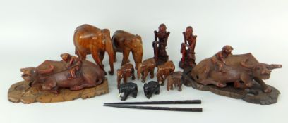 BURMESE / ORIENTAL HARDWOOD CARVINGS including pair of recumbent buffalo, elephant family ETC