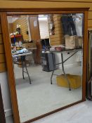 LARGE WOODEN FRAMED BEVELLED WALL MIRROR with Corinthian carving to the sides