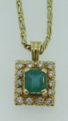 YELLOW METAL (BELIEVED 18CT GOLD) EMERALD & DIAMOND PENDANT ON 18CT GOLD CHAIN, the central emerald