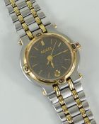 LADIES GUCCI WRISTWATCH model 9000L, yellow and white stainless steel encasement and bracelet, black
