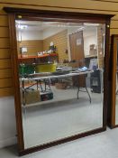 LARGE MAHOGANY FRAMED WALL MIRROR with bevelled edging