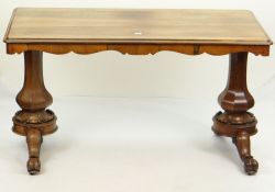 GOOD VICTORIAN ROSEWOOD SIDE TABLE of rounded rectangular form with shaped frieze over faceted and