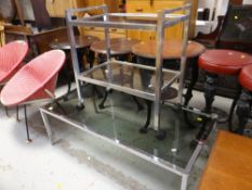CHROME & SMOKY GLASS TWO-TIER TROLLEY, together with a similar long-John coffee table