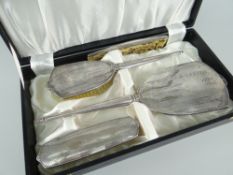 CASED SILVER FOUR-PIECE VANITY SET of two brushes, mirror and comb, of tapered form and with