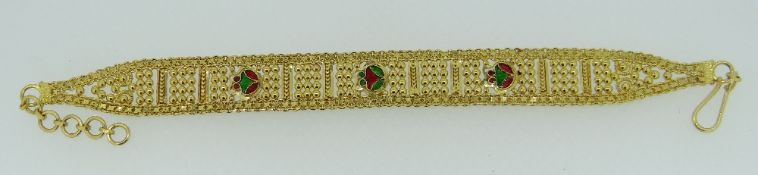 22CT YELLOW GOLD INDIAN FLAT BRACELET with three enamel panels, not hallmarked (or tested), 13.2gms