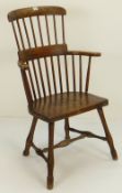 NINETEENTH CENTURY ELM COMB BACK CHAIR with two tier back and on four turned legs joined by H-