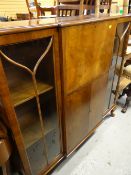 REPRODUCTION MAHOGANY BREAK-FRONT CABINET with drop down upper two door cupboard base on raised
