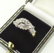 18CT YELLOW GOLD SET DIAMOND CLUSTER CROSS-OVER RING with baton and round diamond combination,