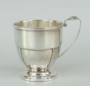 SOLID SILVER CHRISTENING MUG having circular stepped base, Birmingham hallmarks, engraved E.A.R