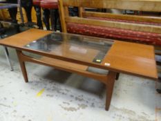 MID-CENTURY G-PLAN TEAK LONG-JOHN COFFEE TABLE with centre glass revealing to a lower shelf
