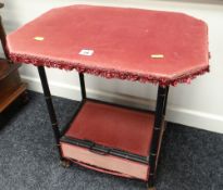 UNUSUAL VINTAGE BAMBOO-EFFECT WORKTABLE having box base on castors and upholstery covered, 55cms