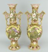 PAIR OF ZSOLNAY PECS PORCELAIN TWIN-HANDLED VASES of baluster form, spreading circular base, waisted