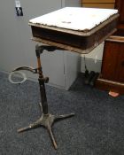 DENTIST'S BRACKET TABLE four-spoked cast iron base, white enamel top, four small drawers Provenance: