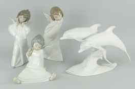 THREE LLADRO FIGURES OF ANGELS, together with a Lladro bisque style dolphin duo