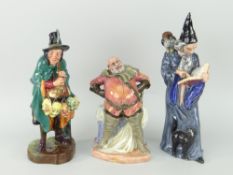 THREE ROYAL DOULTON BONE CHINA FIGURES to include 'The Mask Seller' HN2103, 'The Wizard' HN2877